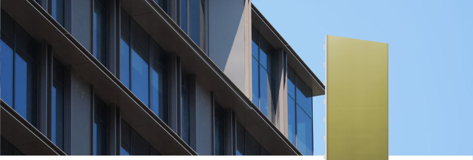 Office façade with gold-coloured LIGHT Pro BIPV panels